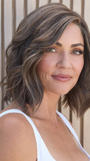 Model is wearing HAUTE by JON RENAU in color 8RH14 MOUSSE CAKE | Medium Brown with 33% Medium Natural Blonde Highlights