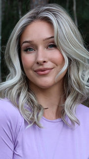 Heather @cjswigs wearing LAGUNA BEACH by BELLE TRESS in color MILKSHAKE BLONDE R | A mixture of Light Sandy Brown, Highlighted with Light Ash Blonde with a Hint of Light Platinum Blonde with a Medium Root Color