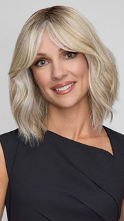 Model is wearing HOLLIE by JON RENAU in color CATALINA BLONDE 101/88/27S8 | Pale blonde with Pure White Natural Violet halo highlights, shaded medium brown