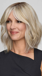 Model is wearing HOLLIE by JON RENAU in color CATALINA BLONDE 101/88/27S8 | Pale blonde with Pure White Natural Violet halo highlights, shaded medium brown