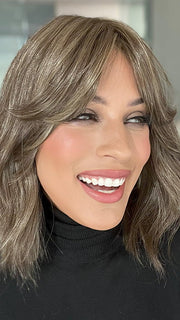 Roxie is wearing HOLLIE PETITE by JON RENAU in shade 8RH14 MOUSSE CAKE | Medium Brown with 33% Medium Natural Blonde Highlight