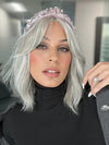 Roxie is wearing HOLLIE PETITE by JON RENAU in shade 56F51 OYSTER | Light Grey with 20% Medium Brown Front, graduating to Grey with 30% Medium Brown Nape (headband not included)