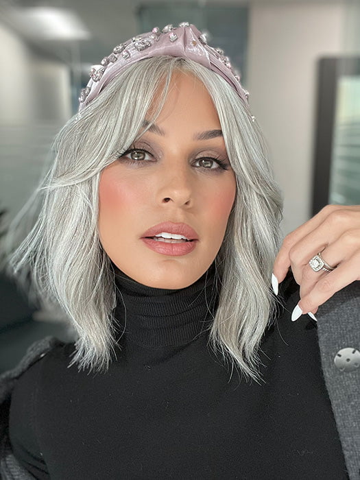 Roxie is wearing HOLLIE PETITE by JON RENAU in shade 56F51 OYSTER | Light Grey with 20% Medium Brown Front, graduating to Grey with 30% Medium Brown Nape (headband not included)