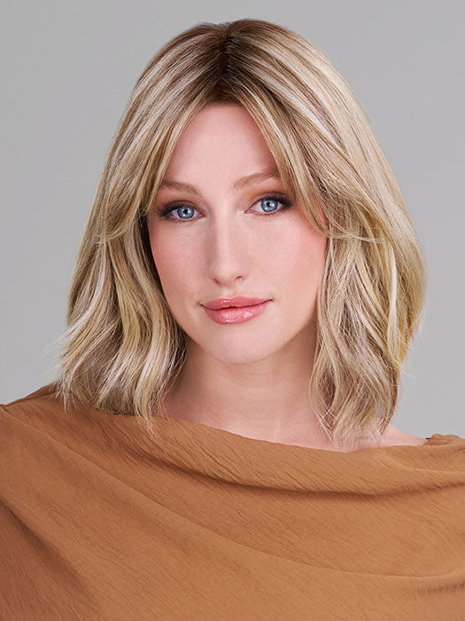 Model is wearing HOLLIE PETITE by JON RENAU in color 12FS12 MALIBU BLONDE | Light Gold Brown, Light Natural Gold Blonde, Pale Natural Gold-Blonde Blend, Shaded with Light Gold Brown