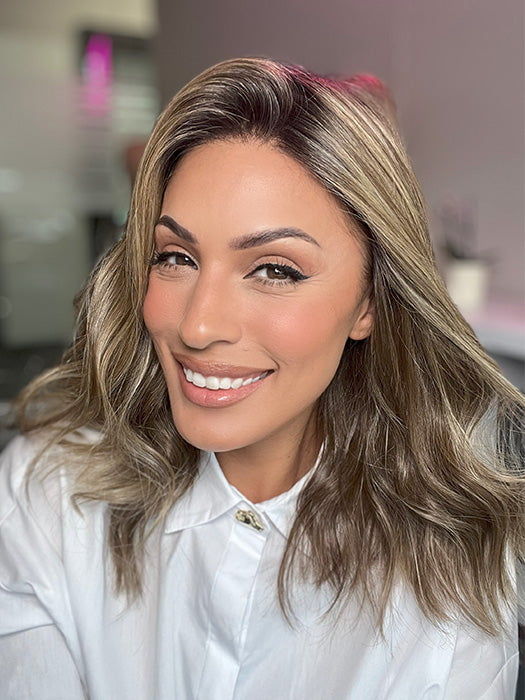 Model is wearing COREY by ENVY in color HONEY BREEZE | A blend of Cool, Honey Blonde and Multi-Dimensional Medium Brown with Darker Brown Roots