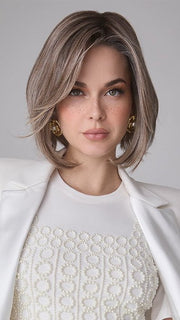 Model is wearing MIRA by AMORE in color TRES CHOCOLATE R | Carefully placed White, Medium, and Dark Chocolate tones completed with a Dark Brown Root. This color is perfect for both Blond and Brown enthusiasts.   