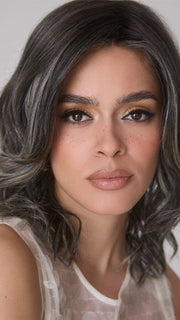 Model is wearing ROHAN by AMORE in color TRUFFLE RIBBON R | Off-Black base with Warm Medium Brown and Silver highlights. The Dark Brown Root creates a naturally dimensional appearance