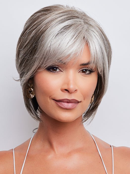 This wig features stacked layers throughout and a feathered fringe