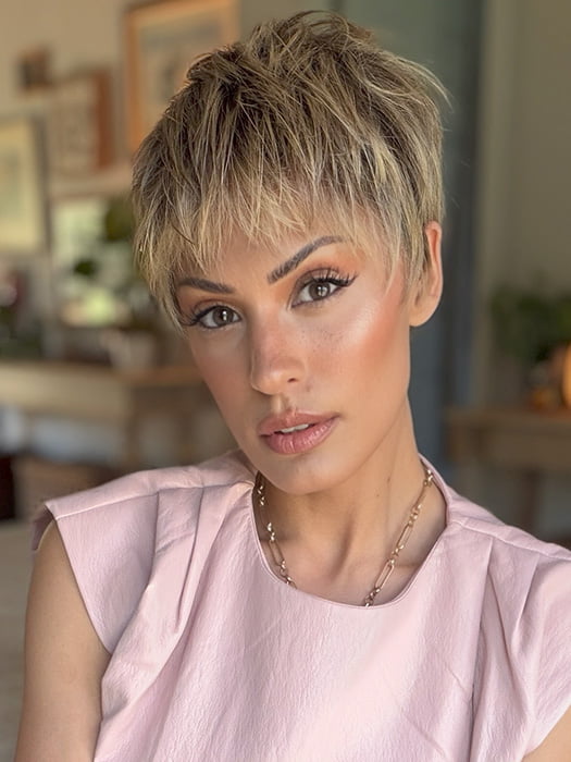 Roxie is wearing IRIS by JON RENAU in color 24BT18S8 SHADED MOCHA | Medium Natural Ash Blonde & Light Natural Gold Blonde Blend, Shaded with Medium Brown