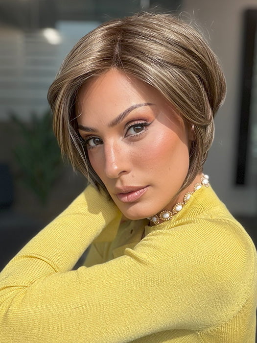 Model is wearing IVY by JON RENAU in shade 8RH14 MOUSSE CAKE | Medium Brown with 33% Medium Natural Blonde Highlights