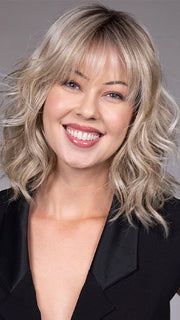 Model is wearing JIL in BUTTERBEER R | Dark Brown Base and Root that transitions smoothly into a buttery blonde, infused with creamy honey and toffee tones