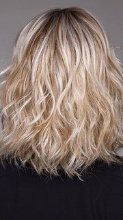 Model is wearing JIL in BUTTERBEER R | Dark Brown Base and Root that transitions smoothly into a buttery blonde, infused with creamy honey and toffee tones