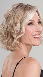 Model is wearing JANUARY by JON RENAU in color 101/88/27S8 CATALINA BLONDE | Pale blonde with Pure White Natural Violet halo highlights, shaded medium brown