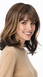 Model is wearing JOLIE by ENVY in color AMARETTO-CREAM | Dark Brown roots with overall Medium Brown base with Honey Blonde highlights