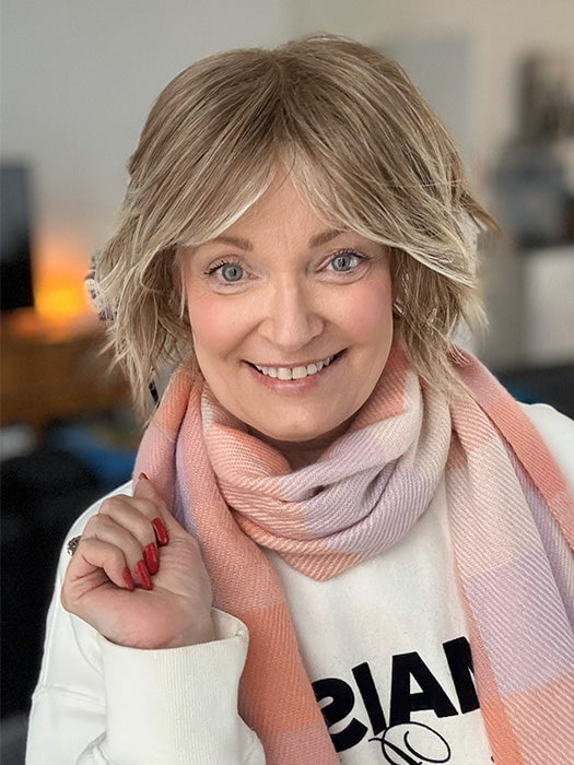 Mel B. @mels.be.ageless wearing JOSS by RENE OF PARIS in color ICE-BLOND | Ashy Blond Base with White Gold Tips and Highlights on face