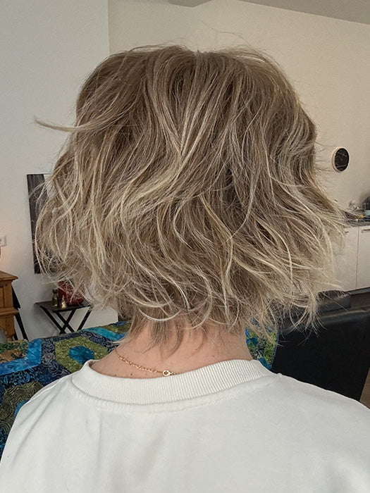 Mel B. @mels.be.ageless wearing JOSS by RENE OF PARIS in color ICE-BLOND | Ashy Blond Base with White Gold Tips and Highlights on face