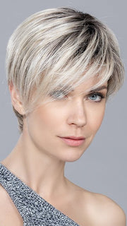The pixie haircut features a longer fringe for a stylish hairstyle