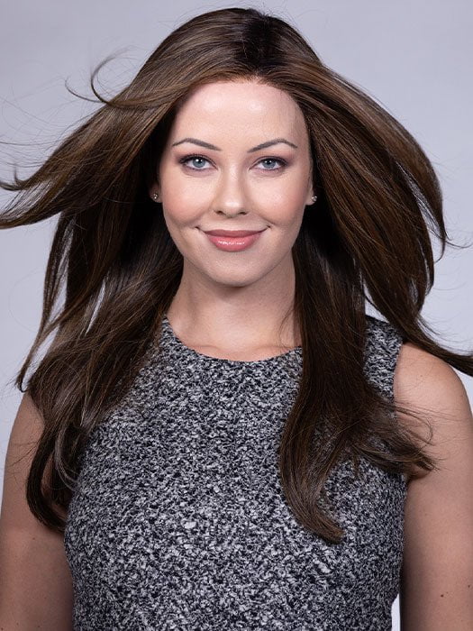 Model is wearing KATNISS by BELLETRESS in color FRENCH ROAST BROWN-R 4/12/27+4 | A deep, luxurious brunette featuring a dark brown base with warm bronze and subtle red undertones. Softly rooted for natural depth and dimension.