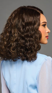 Model is wearing SHANTE by KIM KIMBLE in color MC4/10SS ESPRESSO MARTINI | Dark Brown with Lighter Brown Highlights