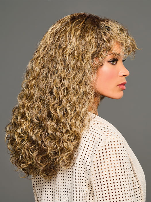 Model is wearing ZARIYA by KIM KIMBLE in color MC11SS BUTTER PECAN | Medium Brown with Golden Blonde Highlights