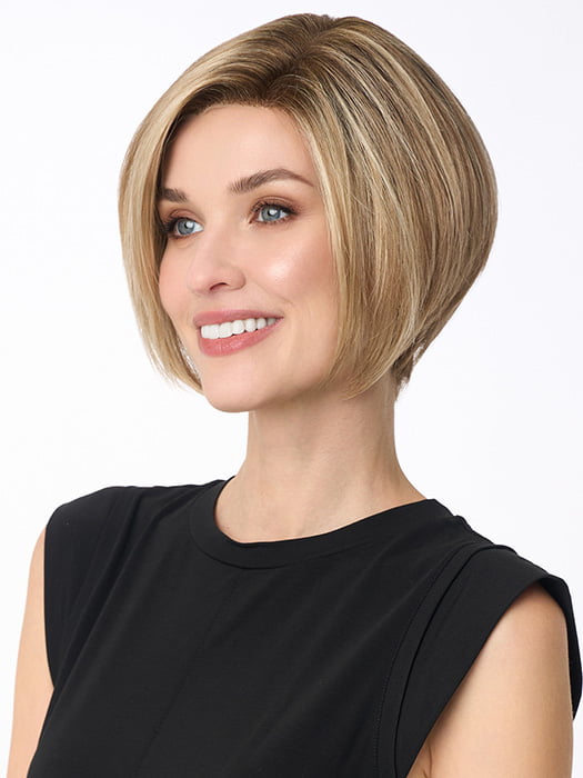 Model is wearing KARI by ENVY in color SPARKLING CHAMPAGNE | Medium Brown roots with overall Strawberry Blonde base and soft Golden Blonde highlights
