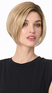 Model is wearing KARI by ENVY in color SPARKLING CHAMPAGNE | Medium Brown roots with overall Strawberry Blonde base and soft Golden Blonde highlights