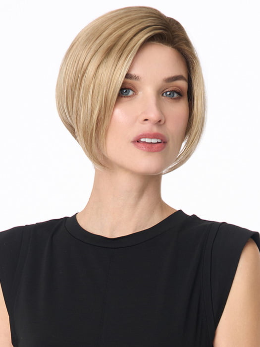 Model is wearing KARI by ENVY in color SPARKLING CHAMPAGNE | Medium Brown roots with overall Strawberry Blonde base and soft Golden Blonde highlights