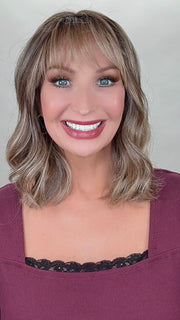Kim Hammon @letstalkwithkim wearing HEPBURN by BELLE TRESS in color BROWN SUGAR BLONDE-R | A warm, dimensional blend of medium brown and golden blonde highlights with natural-looking darker roots for depth and a sun-kissed finish.