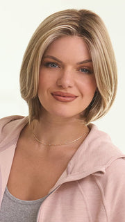 Model is wearing KRISTI by JON RENAU in color 12FS8 SHADED PRALINE | Light Gold Brown, Light Natural Gold Blonde & Pale Natural Gold-Blonde Blend, Shaded with Medium Brown