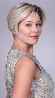 Model is wearing LENOX By BELLETRESS in CRUSHED-ALMOND-BLONDE-R | A Soft Neutral Light Blonde with a Light and Medium Blended Root Color