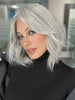 Roxie is wearing HOLLIE PETITE by JON RENAU in shade 56F51 OYSTER | Light Grey with 20% Medium Brown Front, graduating to Grey with 30% Medium Brown Nape (headband not included)