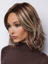 Model is wearing LORYN in SNOWY UMBER R | Medium Ginger Brown base with White Blond highlights