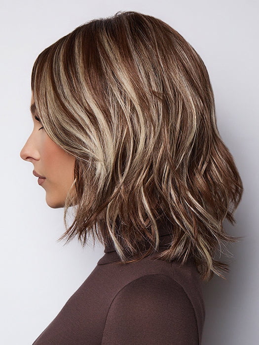 Model is wearing LORYN in SNOWY UMBER R | Medium Ginger Brown base with White Blond highlights