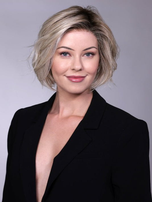 Model is wearing CRUSHED ALMOND BLONDE R | A soft Neutral Light Blonde with a Light and Medium Blended Root Color.