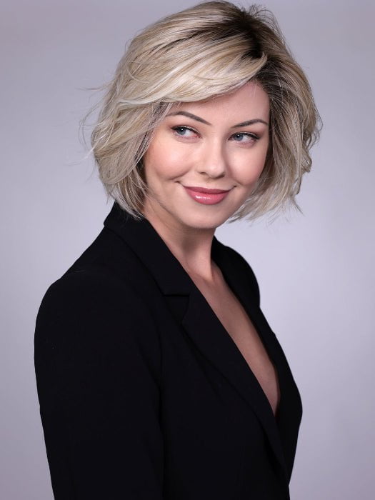 Model is wearing CRUSHED ALMOND BLONDE R | A soft Neutral Light Blonde with a Light and Medium Blended Root Color.