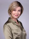 Model is wearing MANCHESTER in RAW SUGAR BLONDE | A Neutral Light Blonde, Honey Blonde, Pale Gold Blonde, with a base of Light Brown Low Lights featuring a Medium Root Color