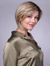 Model is wearing MANCHESTER in RAW SUGAR BLONDE | A Neutral Light Blonde, Honey Blonde, Pale Gold Blonde, with a base of Light Brown Low Lights featuring a Medium Root Color