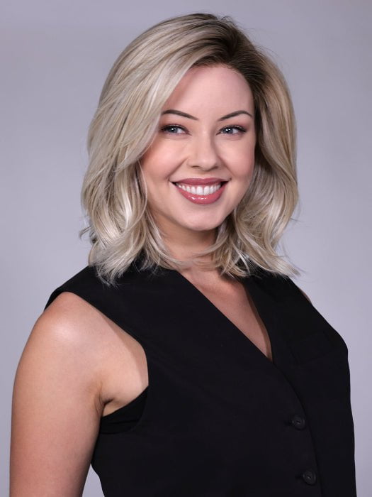 Model is wearing MANHATTAN by BELLETRESS in color CRUSHED-ALMOND-BLONDE-R | A soft Neutral Light Blonde with a Light and Medium Blended Root Color
