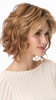 Model is wearing MARSHA by ENVY in color GOLDEN NUTMEG | Medium Brown roots with overall Warm Cinnamon base and Golden Blonde Highlights