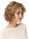 Model is wearing MARSHA by ENVY in color GOLDEN NUTMEG | Medium Brown roots with overall Warm Cinnamon base and Golden Blonde Highlights