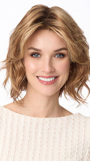 Model is wearing MARSHA by ENVY in color GOLDEN NUTMEG | Medium Brown roots with overall Warm Cinnamon base and Golden Blonde Highlights