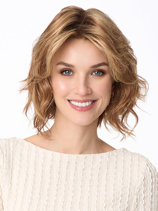 Model is wearing MARSHA by ENVY in color GOLDEN NUTMEG | Medium Brown roots with overall Warm Cinnamon base and Golden Blonde Highlights