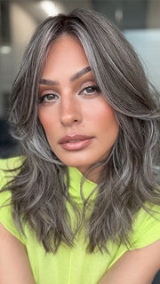 Model is wearing MAUDE by AMORE in color MUSHROOM-GREY-R | Dark brown incorporates light brown and silvery grey tones with shadow roots for a stylish finish.