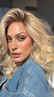 Roxie is wearing the MILLION DOLLAR BABE by TRESSALLURE in color 24/102/R12 | Gold Blonde with Platinum highlights with Gold Brown roots