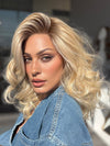 Roxie is wearing the MILLION DOLLAR BABE by TRESSALLURE in color 24/102/R12 | Gold Blonde with Platinum highlights with Gold Brown roots
