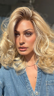 Roxie is wearing the MILLION DOLLAR BABE by TRESSALLURE in color 24/102/R12 | Gold Blonde with Platinum highlights with Gold Brown roots
