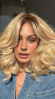 Roxie is wearing the MILLION DOLLAR BABE by TRESSALLURE in color 24/102/R12 | Gold Blonde with Platinum highlights with Gold Brown roots