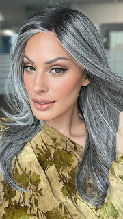 Model is wearing MIRROR MOMENT by GABOR in color GF44-60SS SUGARED LICORICE | Salt Dark Brown with Subtle Warm Highlights Roots