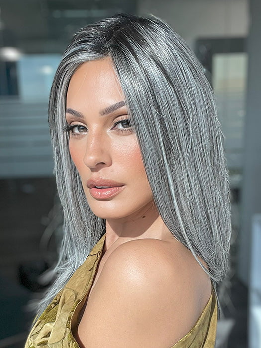 Model is wearing MIRROR MOMENT by GABOR in color GF44-60SS SUGARED LICORICE | Salt Dark Brown with Subtle Warm Highlights Roots