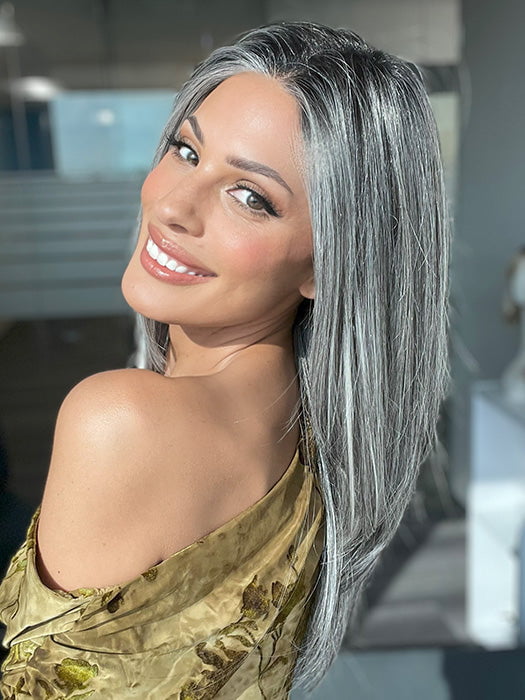 Model is wearing MIRROR MOMENT by GABOR in color GF44-60SS SUGARED LICORICE | Salt Dark Brown with Subtle Warm Highlights Roots